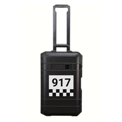 Black SUITCASEƎ Racecar Porsche 917 Le Mans Waterproof Carry-On Suitcase designed for smooth rolling with vibrant chequered artwork.