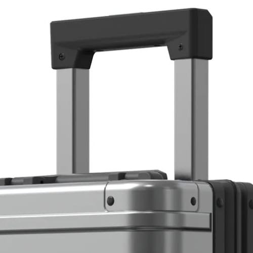 Gunmetal grey Origin 4 Series Aluminium medium check-in Suitcase and hold luggage wheel detail case and handle detail