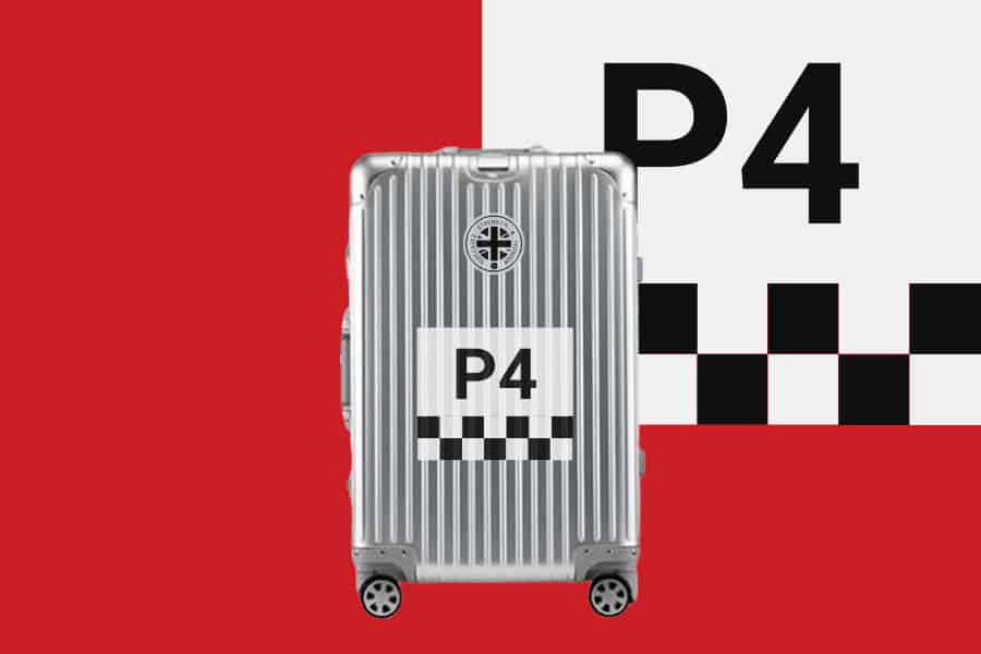 SUITCASEƎ Racecar Ferrari 330 P4 Aluminium Carry-On Suitcase designed for easy rolling with striking chequered artwork on the cabin bag.