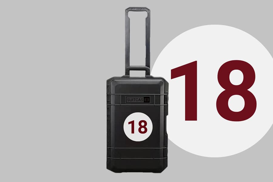 Black SUITCASEƎ Driver Fangio 18 Waterproof Carry-On Suitcase - Durable, stylish design for motor racing fans and travellers.