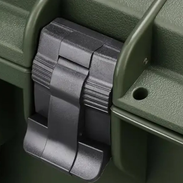 Green SUITCASEƎ Icon Check-In Suitcase latch detail, waterproof rolling luggage for secure travel and camera equipment protection