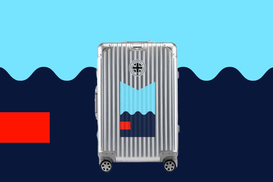 SUITCASEƎ Trip Series Biarritz Blue Aluminium Carry-On Suitcase in Silver, blending durability with stunning Atlantic wave design.