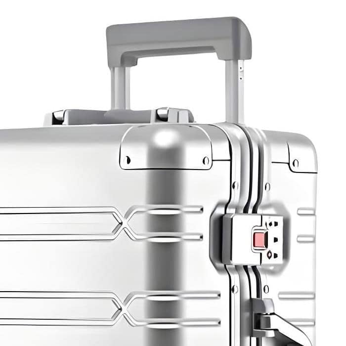 Closeup of a Silver SUITCASEƎ Origin 3 Medium Check-In suitcase, luxury aluminium design with durable handle and TSA-approved lock.