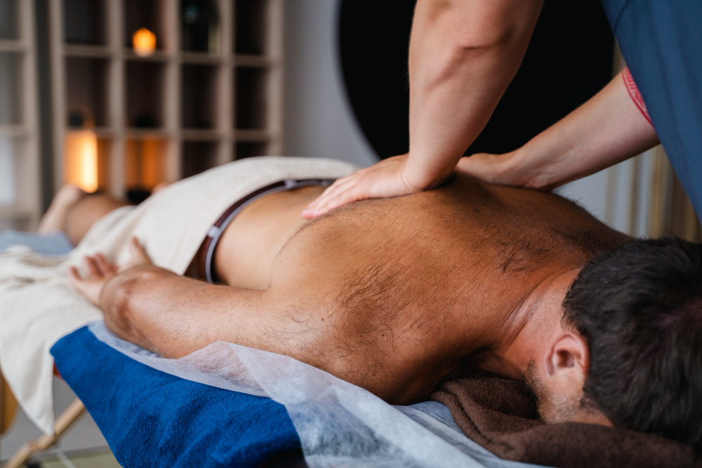 Tall slender porcelain bottle with natural clay textured body and cork stopper.