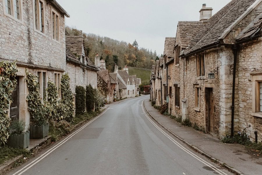 View down the high street in Castle Combe Village in the Cotswolds, Wiltshire, UK - Photo by Eleanor Brooke Castle Combe England