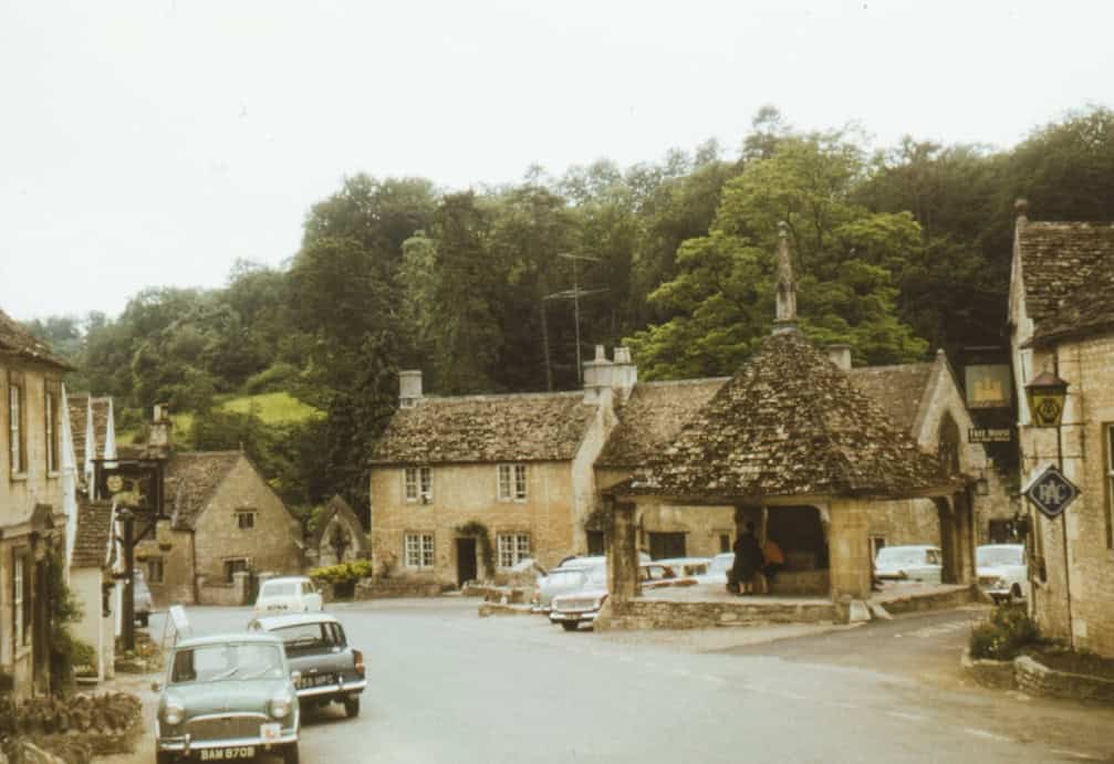 1965 view of the high street of movie location Castle Combe Village in the Cotswolds, Wiltshire, UK - Photo by Annie Spratt | Castle Combe England