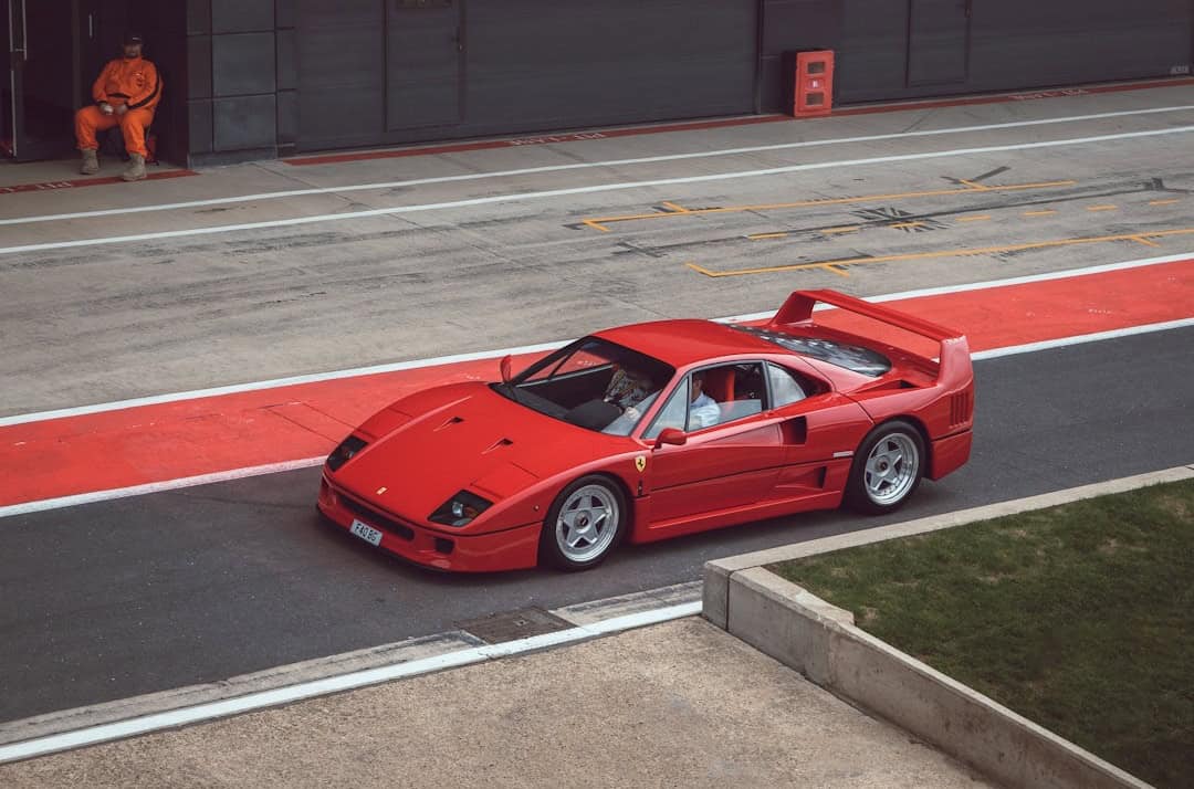 Classic Red Ferrari F40 car on the track - Castle Combe Race Circuit, North Wiltshire, UK – Photo by Richard Fullbrook | Castle Combe England