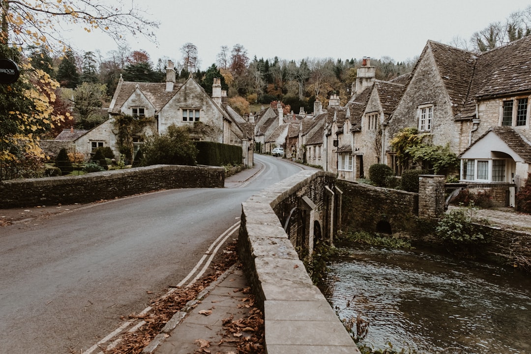 Village over Bybrook river the Beautiful Cotswolds Castle Combe Village in Wiltshire, UK - Photo by Eleanor Brooke Castle Combe England