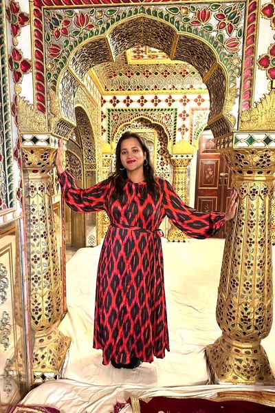 Meghna Patel in ornate archway at Jaipur