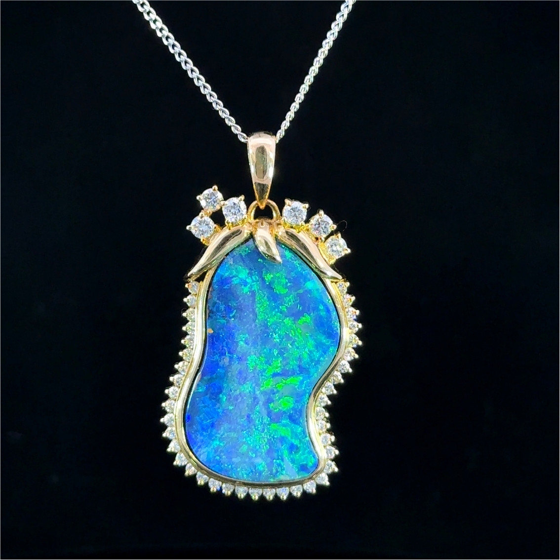 Black opal and diamond pendant