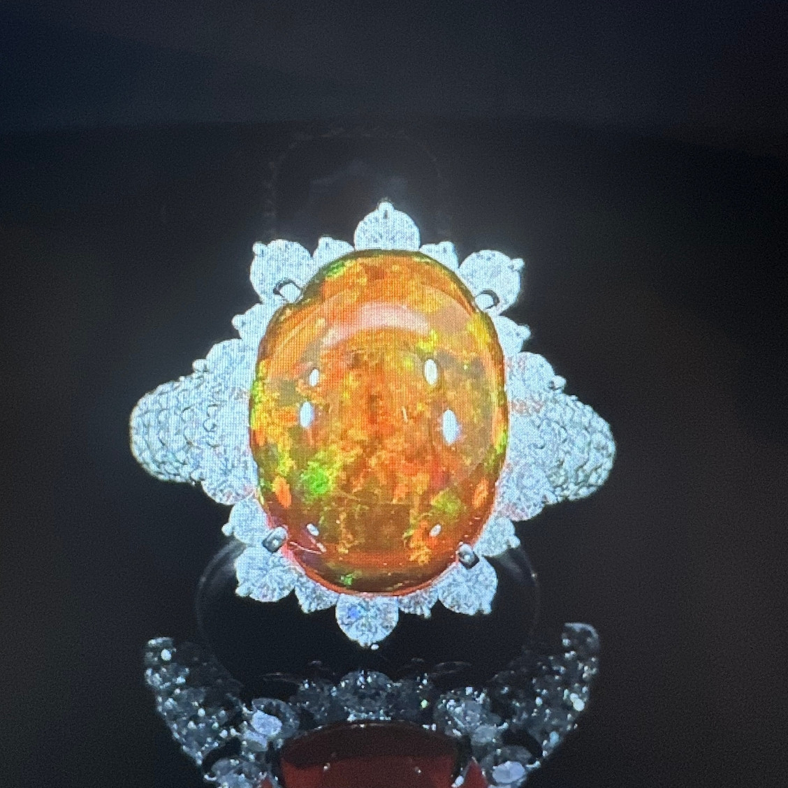 Black opal and diamond ring with fiery orange center
