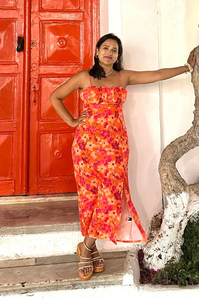 Meghna Patel by red door in Mykonos