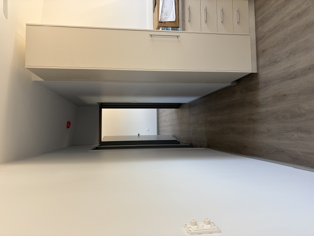 Kitchen and living interior inside custom modular accommodation built in Darwin