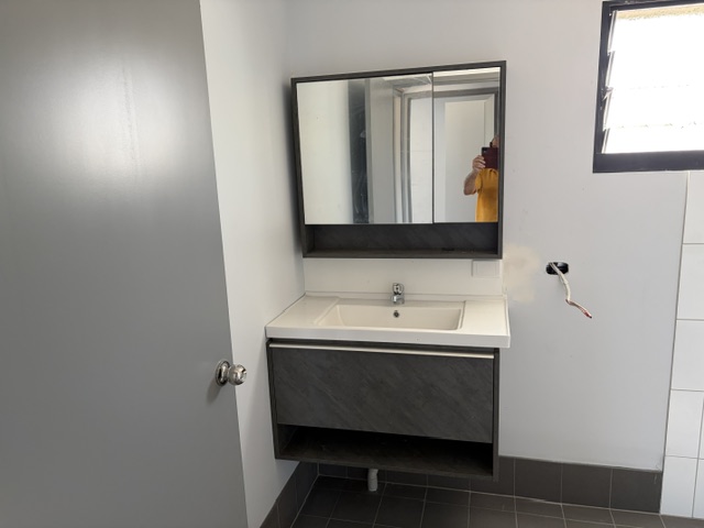 Bathroom vanity and mirror inside Darwin-built transportable accommodation