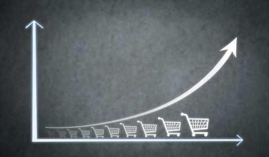 Collection of four insulated travel bottles on wooden shelf.