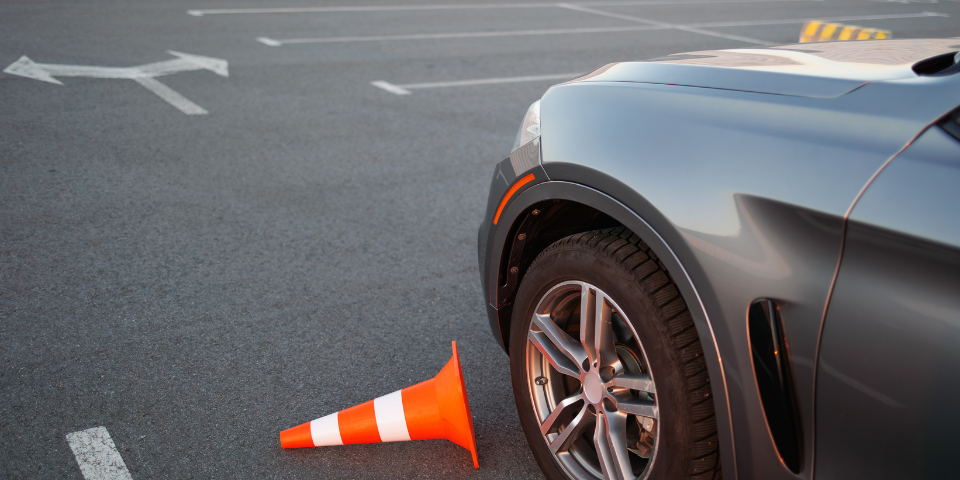 Desk with leather desk pad, walnut desk organizer, wireless keyboard and mouse, and porcelain mug.
