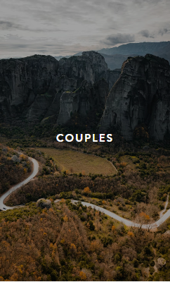 Person using a pen to cross a task off a productivity paper card.