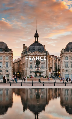 Hand holding black machined steel mechanical pencil with brass tip and top.