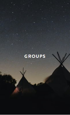 Hand holding black machined steel mechanical pencil with brass tip and top.