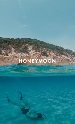 Olive drab green insulated bottle with flared screw lid and flat top.