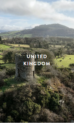 Person using a pen to cross a task off a productivity paper card.