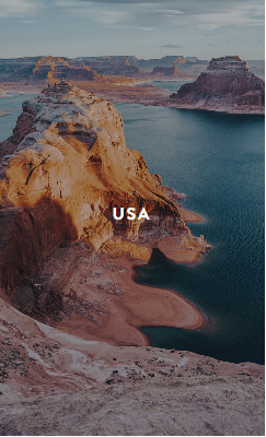 Hand holding black machined steel mechanical pencil with brass tip and top.