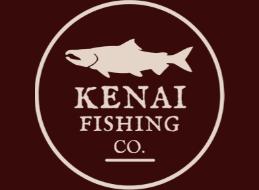 Wood table with porcelain mug, leather journal, brass pen, leather key ring, and a houseplant.