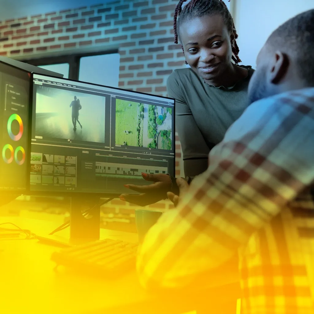 Students working in the editing suite at Revele Creative Academy, Accra