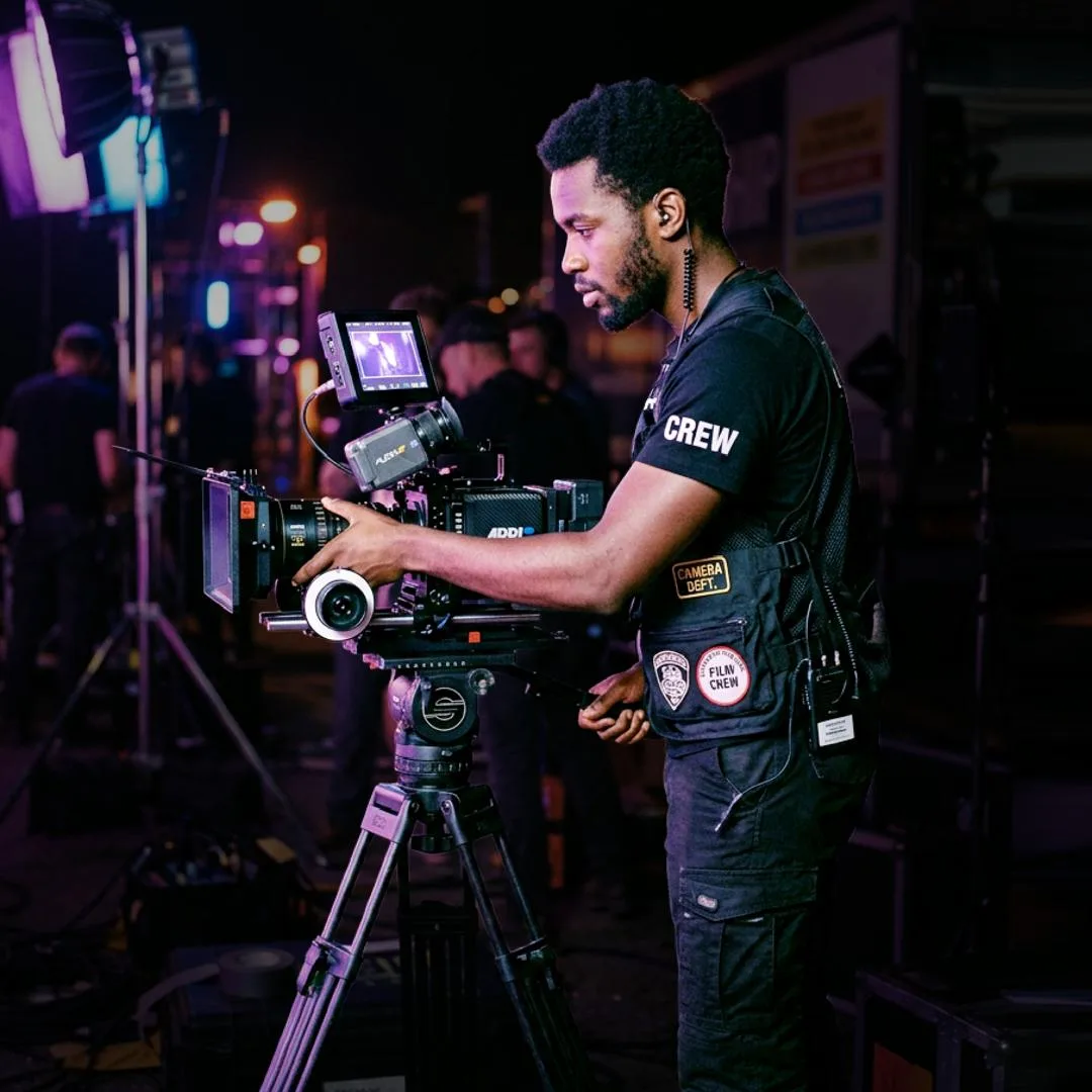 A camera operator on a Revele Films production set in Accra