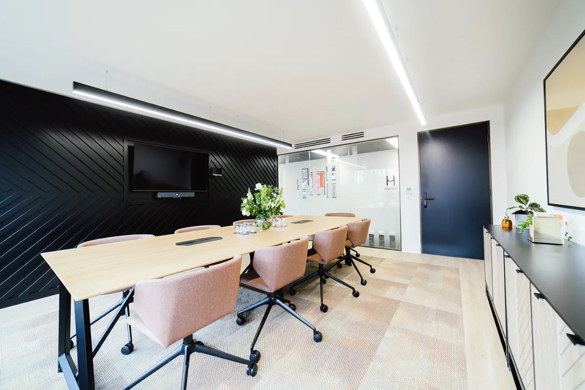 A boardroom-style classroom with natural light for advanced English for professionals in London