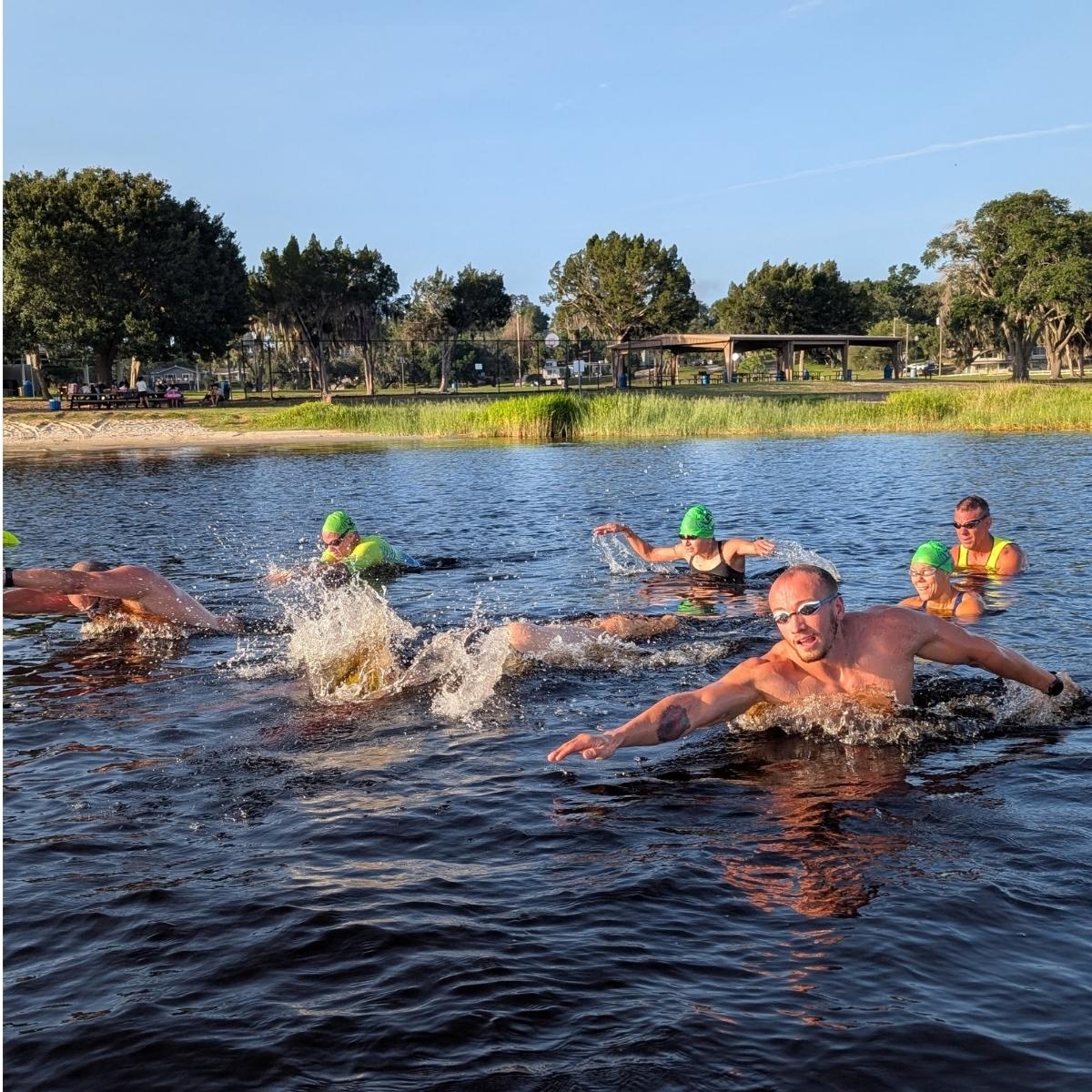 Coach leading an open-water swim skills session