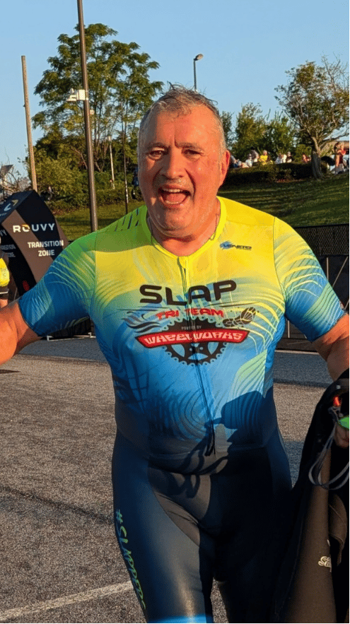 Coach Don Jackson with youth cyclists