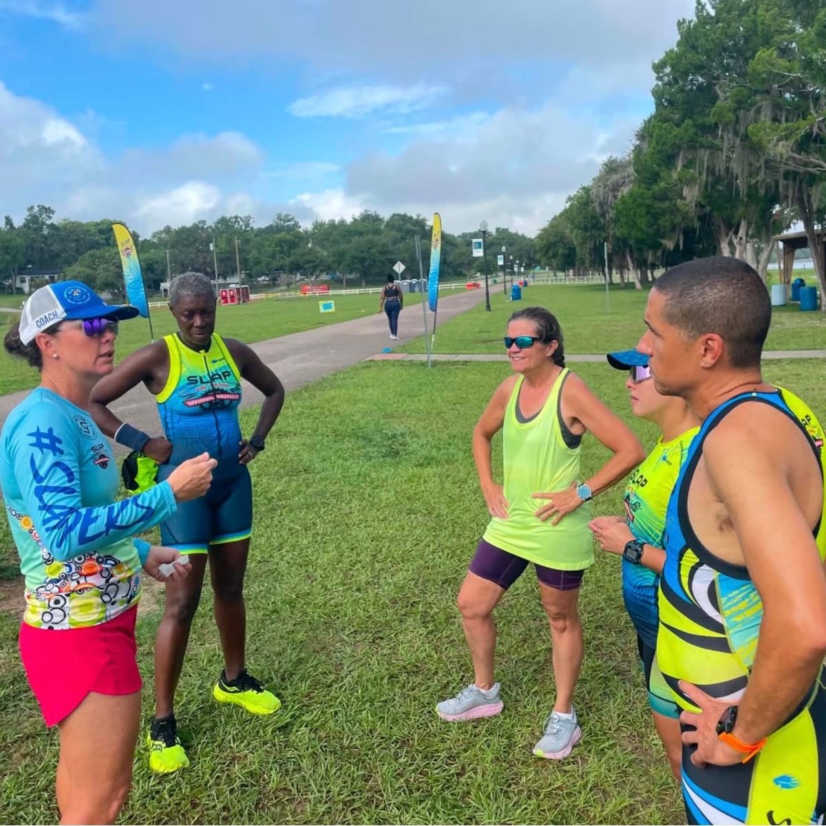 SLAP coaches leading a group through triathlon transitions