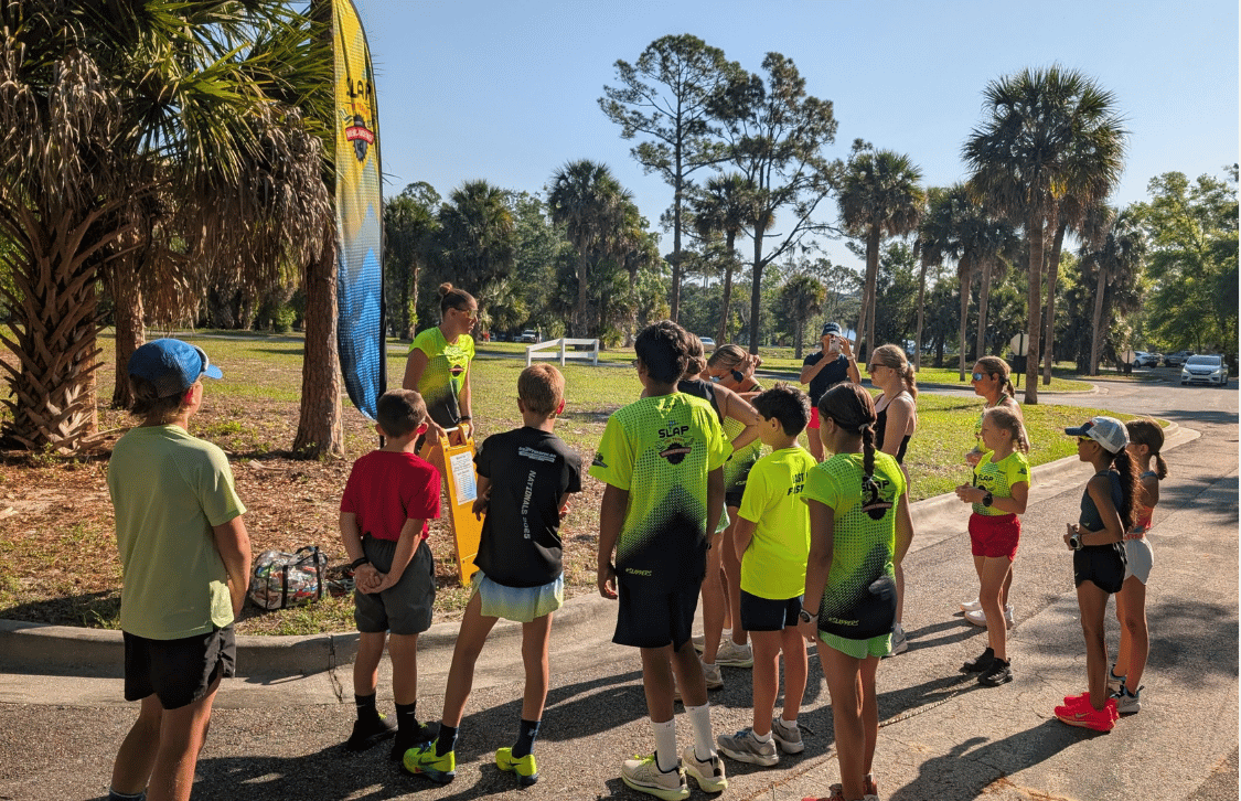 Runners training together at sunrise