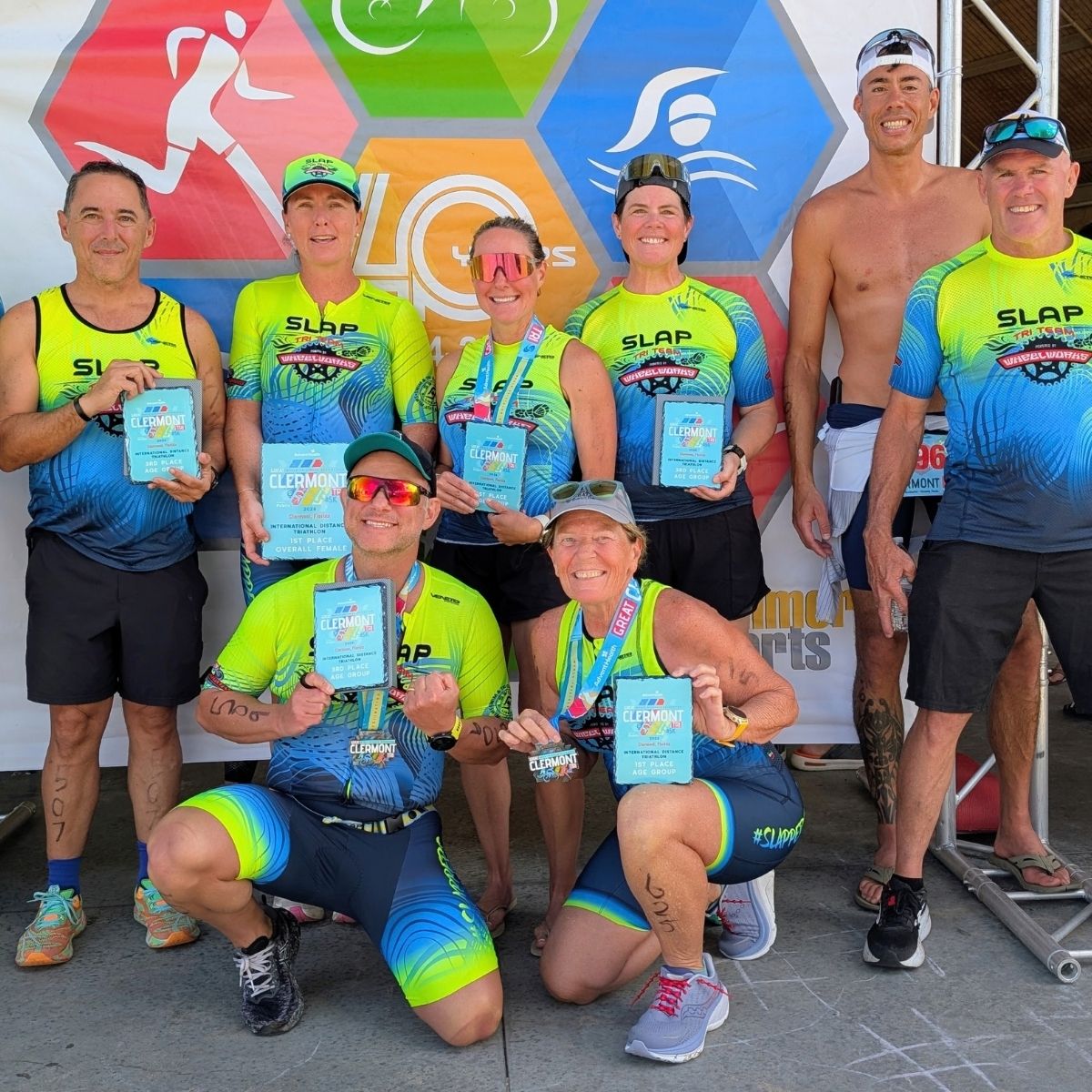 SLAP Tri Team celebrating at a triathlon awards ceremony