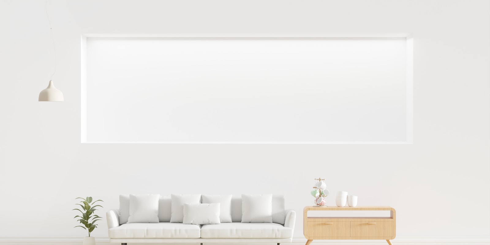 A bright white living room featuring a comfortable sofa and a stylish lamp, creating a cozy atmosphere.