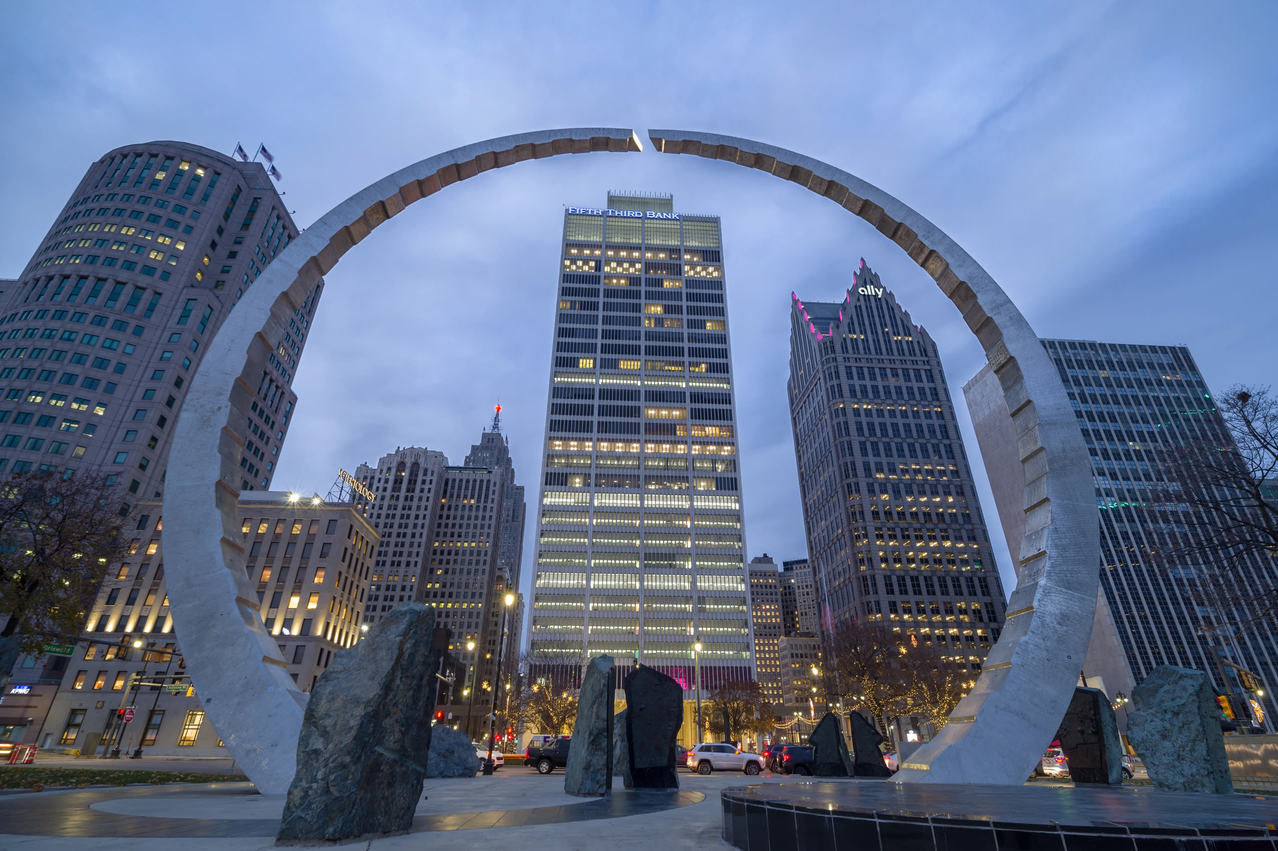 Transcending monument arch framing downtown Detroit at dusk