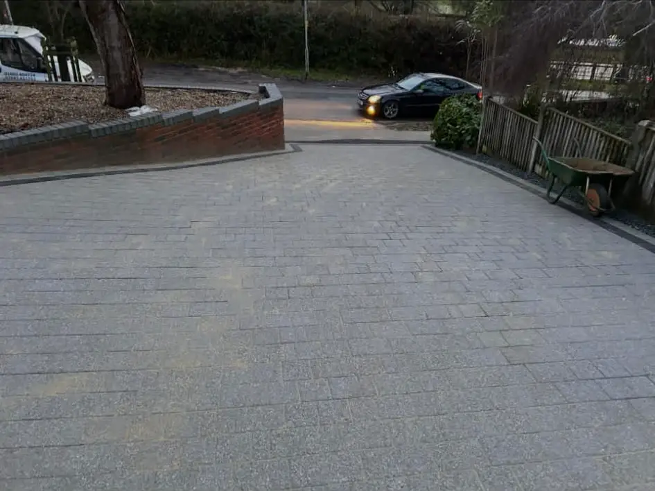 Driveway set out with crisp paving grid.