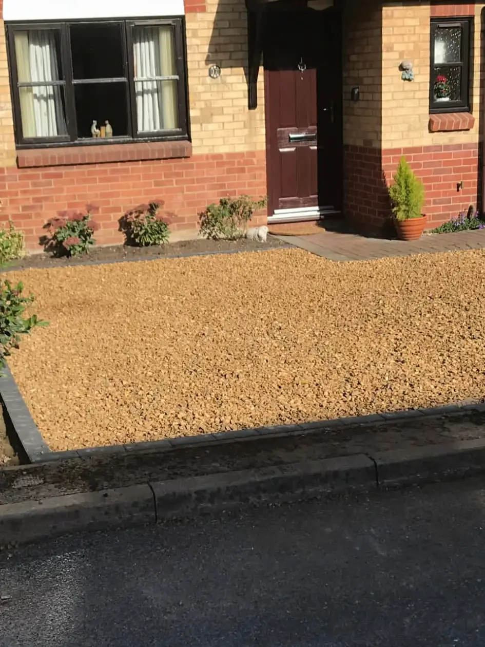 Driveway with subtle curve towards entrance.
