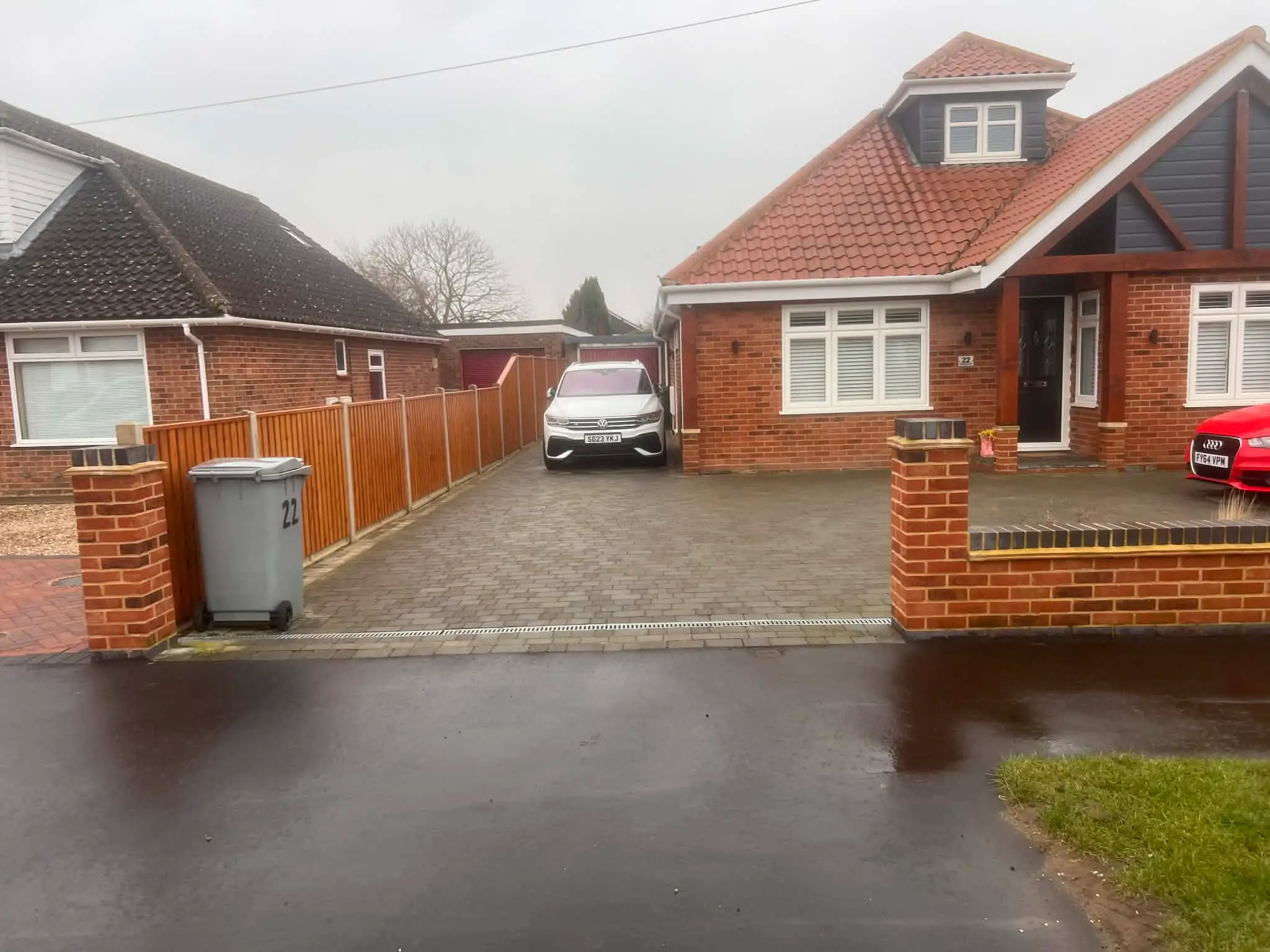 Driveway reshaped to create turning bay.