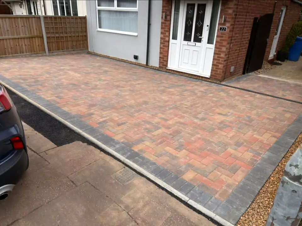 Driveway extended to create extra parking bay.