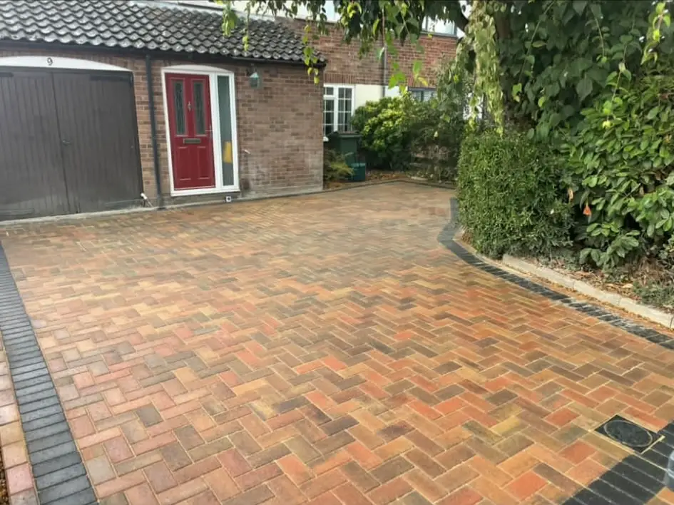Block paving driveway with contrasting border detail.