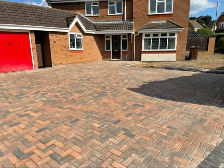 Driveway with gentle slope and drainage channel.