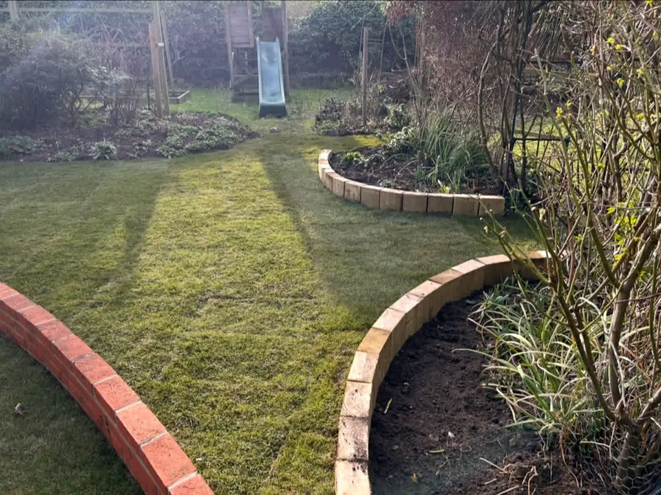 Landscaped garden with formal planting and path.