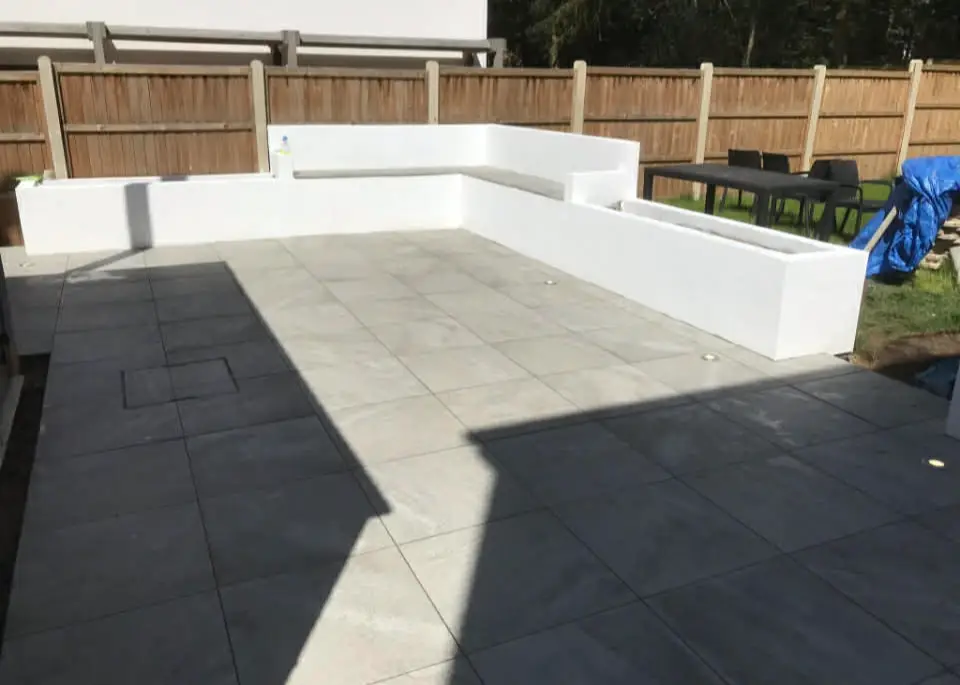 Lawn edged with precise steel or stone detail.