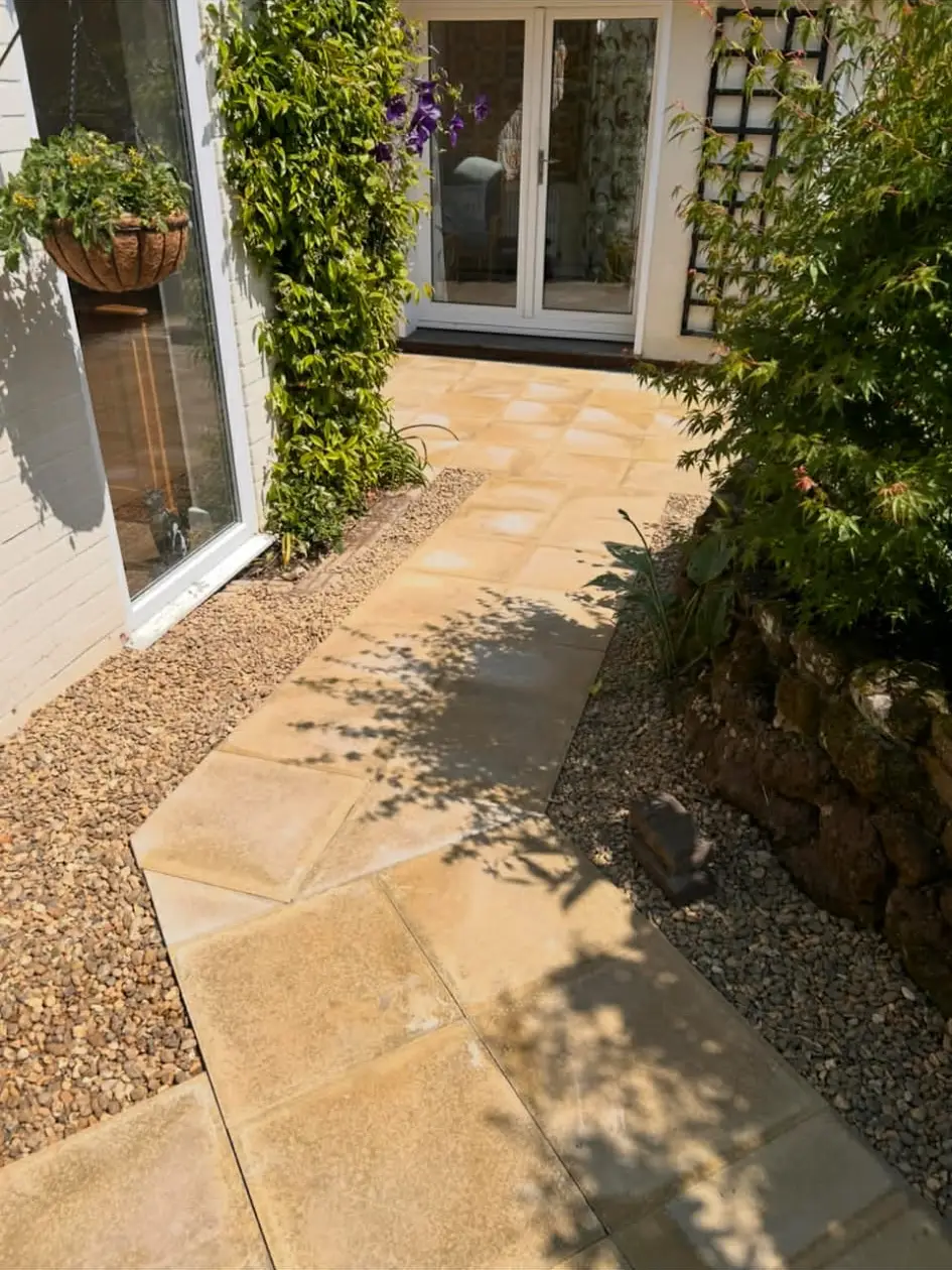 Curved garden path linking patio and lawn.