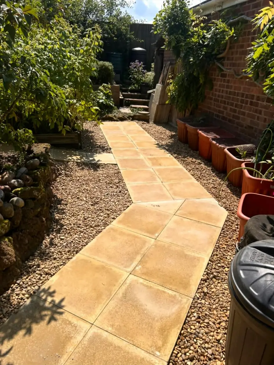 Garden path weaving between planting beds.