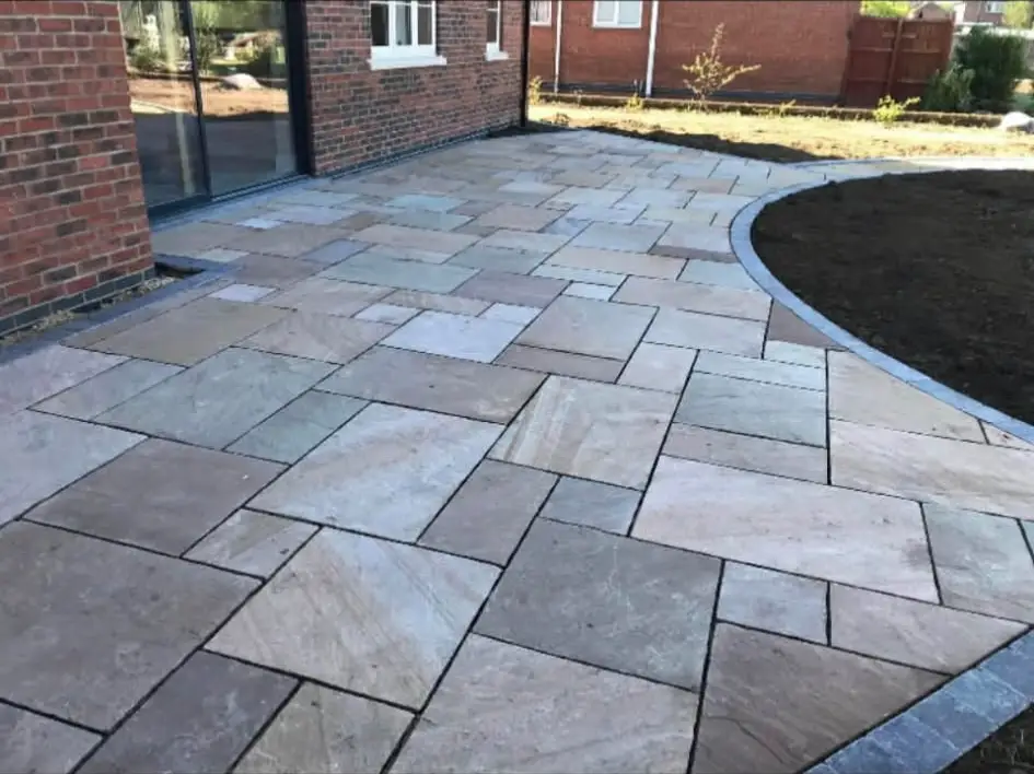 Bright porcelain patio with outdoor seating.