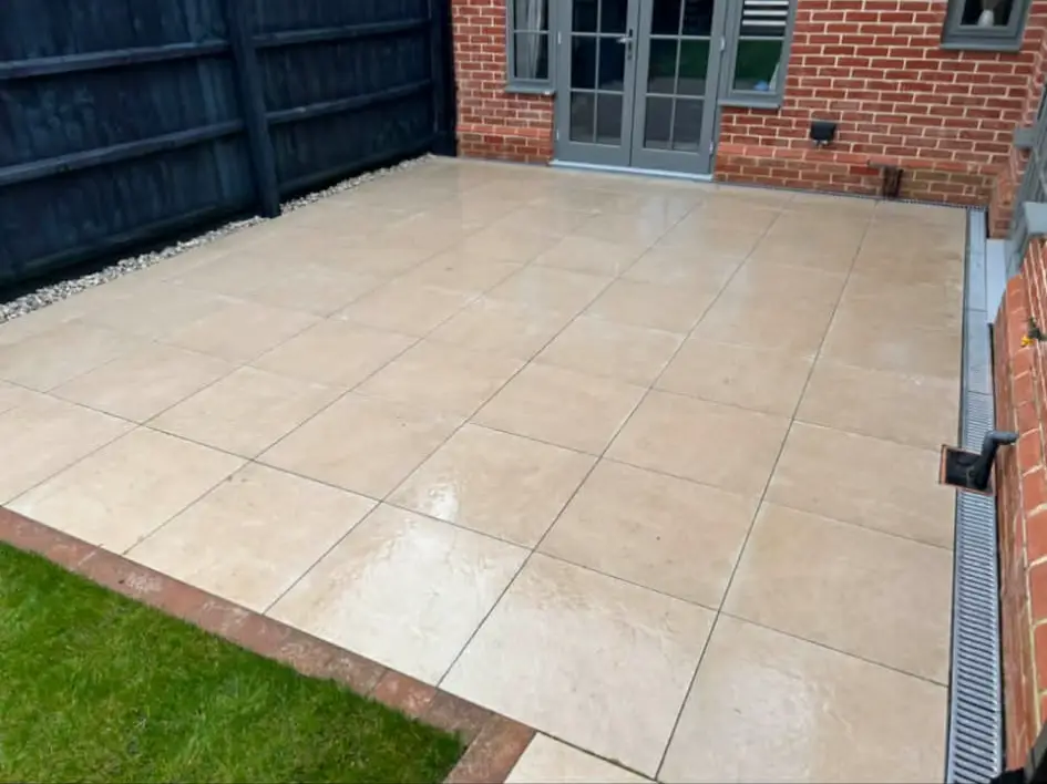 Patio framed with slim planting beds.