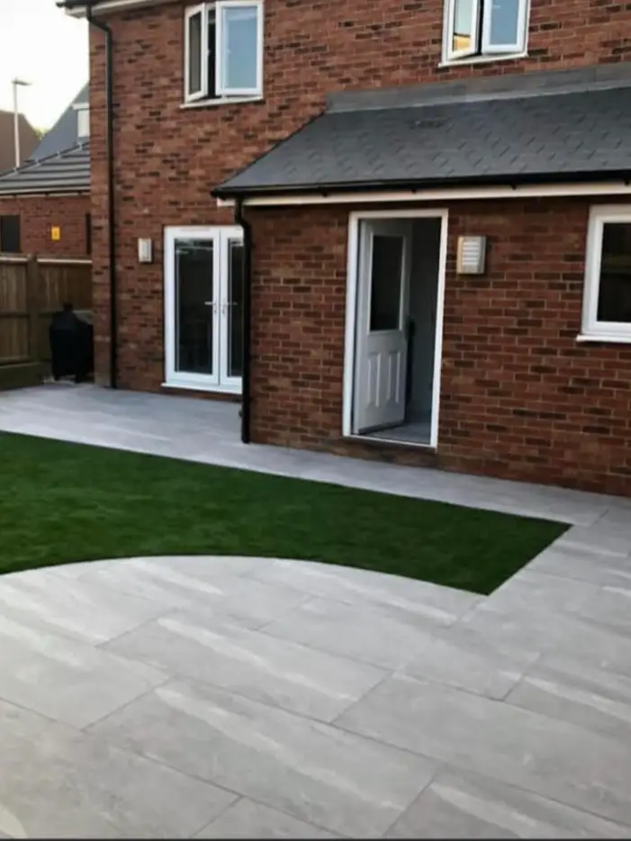 Patio reshaped to align with garden boundary.